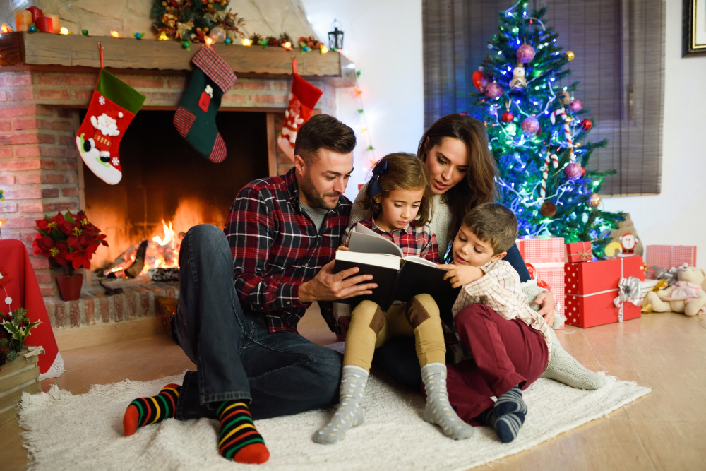 couple-reading-book-with-children-their-living-room-decorated-christmas
